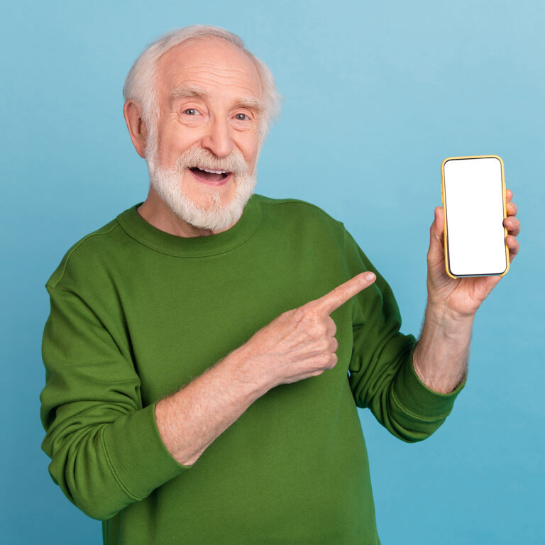 Portrait of positive funky aged person indicate finger empty space proposition isolated on blue color background.